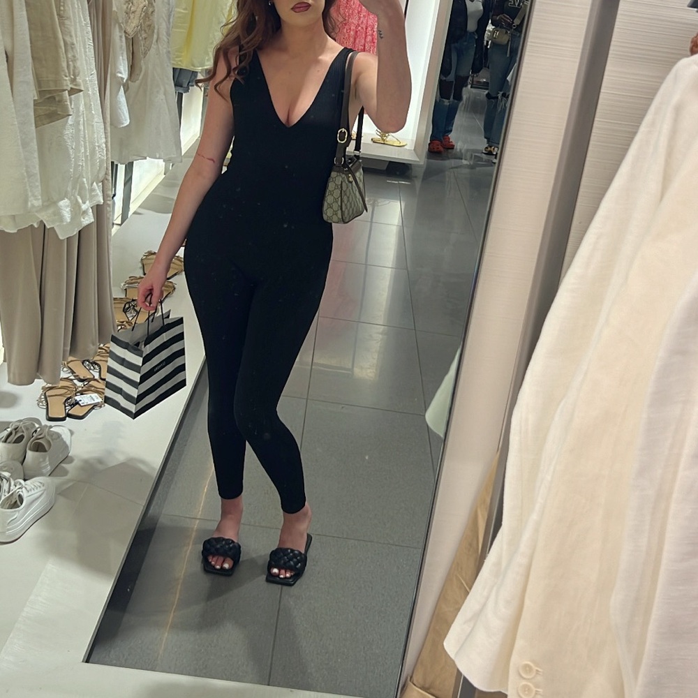 Black Women's Jumpsuit
Super cute hugs curves 
Perfect condition
